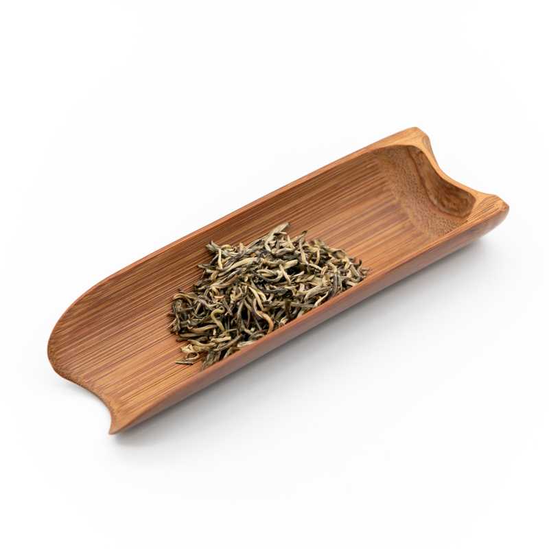 Premium Jasmine Green Tea in a scoop